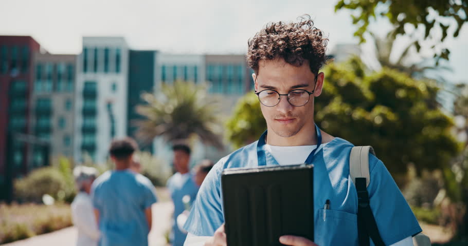 Happy man, outdoor and success on tablet for education, communication and learning as medical student. Male person, winner and tech for connection, internet or scroll in university campus or hospital