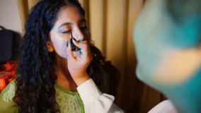 Gentle Black Strokes on Eyes Create Stunning Look, Makeup Artist Applies Eyeliner to Curly Haired Model, Young Woman Gets Styled in Beauty Studio, Beauticians Steady Hand Works on Soft Face Feature - Powered by Shutterstock - Get 15% off with code: PIKWIZARD15