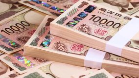 Translation: 10,000 yen, Bank of Japan note, Bank of Japan, produced by the National Printing Bureau, Eiichi Shibusawa 10,000 yen notes, rotating - Powered by Shutterstock - Get 15% off with code: PIKWIZARD15