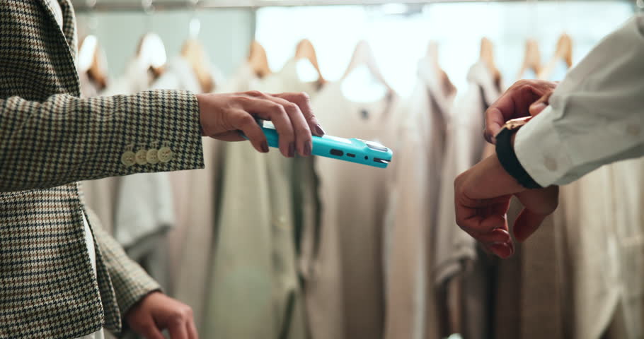 Shopping, card machine and hands of customer with watch in store for bargain, retail sale and purchase. Mall, fashion and person for online transaction, tap payment and POS in boutique for clothing