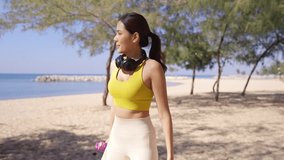 Healthy Asian woman do sport training jogging exercise at tropical beach. Sporty girl drinking water from reusable plastic bottle after workout running at seaside. Wellness healthcare motivation. - Powered by Shutterstock - Get 15% off with code: PIKWIZARD15