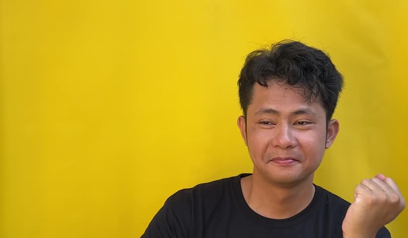 A handsome Asian man expressing different emotions through a range of facial expressions. Capturing diverse human moods in a clear and engaging portrait style. - Powered by Shutterstock - Get 15% off with code: PIKWIZARD15