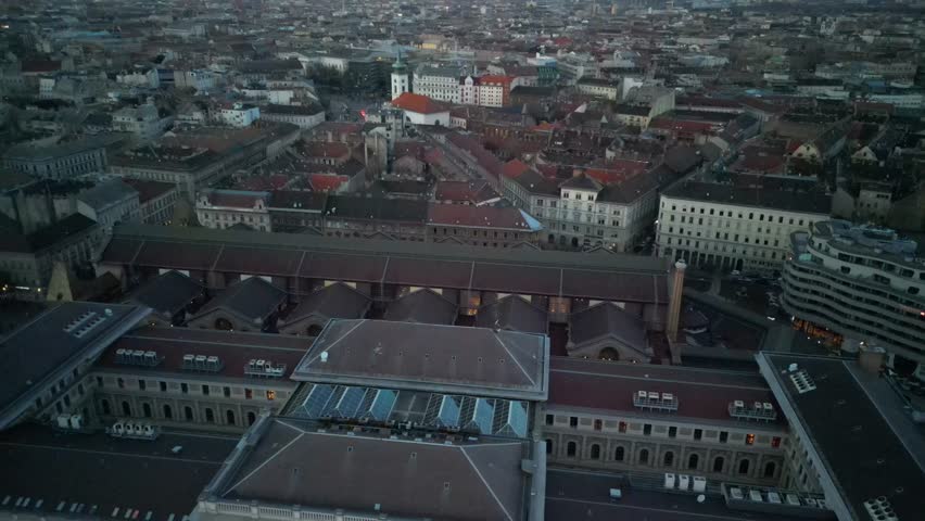 Budapest Market Hall Aerial

An aerial evening view of Budapest’s Great Market Hall and surrounding historic rooftops in soft twilight.

