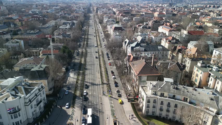 Andrássy Avenue Budapest

Aerial view of Andrássy Avenue, Budapest’s grand boulevard lined with historic buildings and tree-lined streets.
