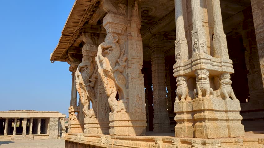 Intricately Carved Pillars Overlooking Open Courtyard in Hampi, Karnataka, India