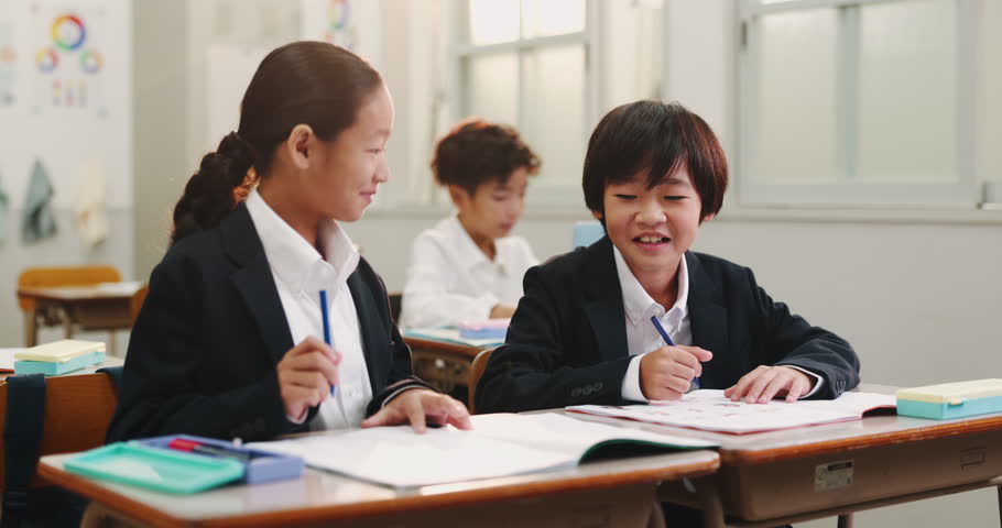 Japanese, kids and students in classroom, writing and education with help, growth and knowledge. Advice, Asian children and friends with workbook, learning or development with smile, joy and studying
