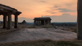 Hemkuta Hill Sunset with Historic temple Architecture in Hampi, Karnataka, India - Powered by Shutterstock - Get 15% off with code: PIKWIZARD15