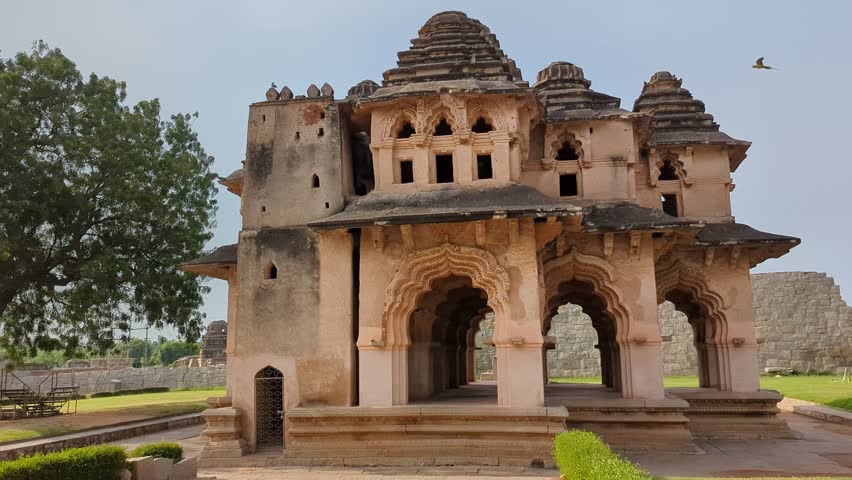 Birds Soaring Above the Majestic Lotus Mahal in Hampi, Karnataka, India