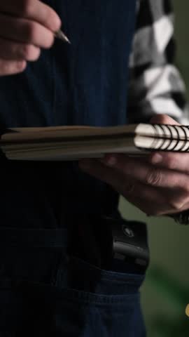 Waiter Writing A Christmas Order In A Notepad, Taking An Order From A Customer In A Restaurant, Vertical Video