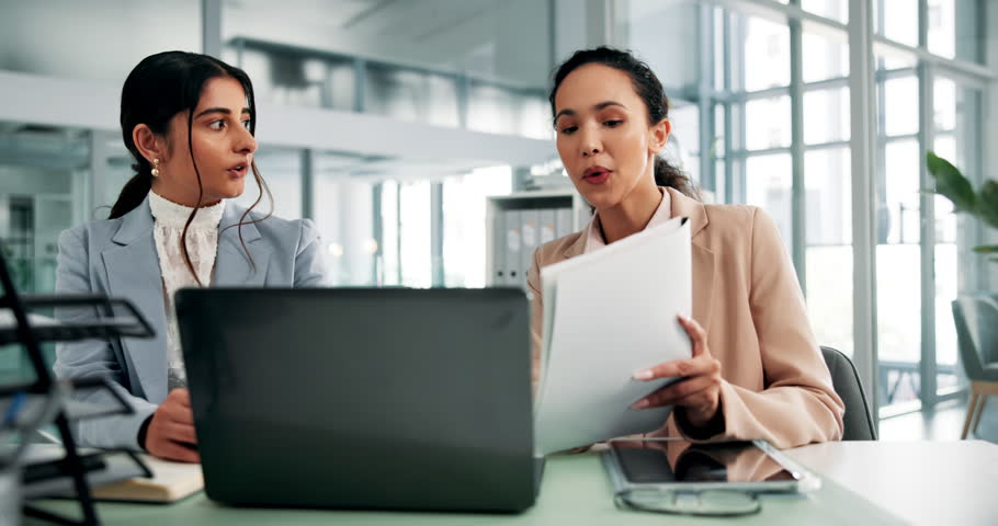 Office, business people and documents with laptop for discussion, finance and investment research. Collaboration, women and financial advisor with digital for risk management, review report or advice