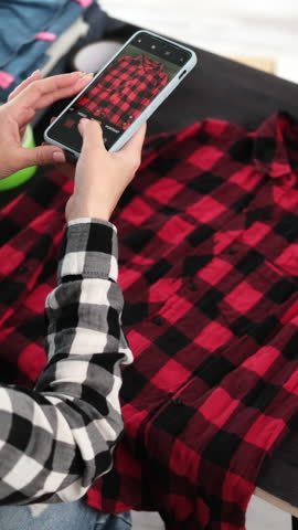 Girl Takes Photos With Smartphone For Online Selling Shirt Board For Pre-Owned Clothing, Vertical Video