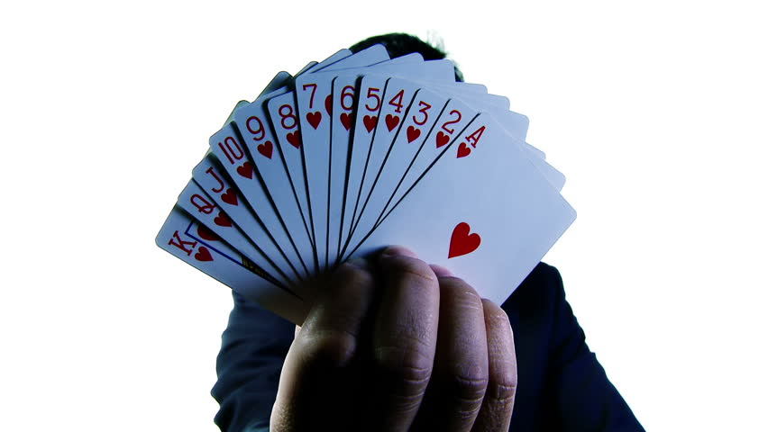 Businessman presents a suit of cards, all the hearts. Two clips. Mid shot and