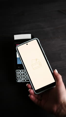 Payment Processing And Approved Status Displayed On A Smartphone Screen On A Table Top View, Vertical Video