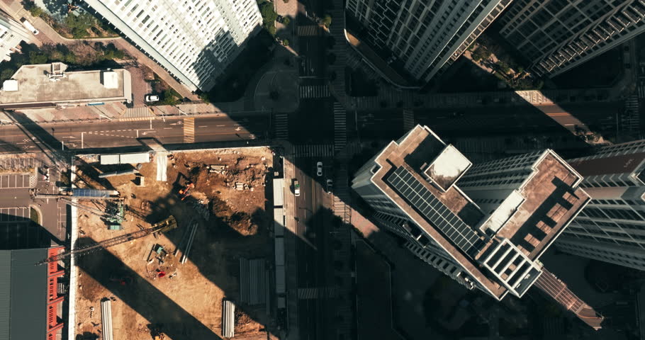 Aerial top down view of traffic and residential buildings in Busan, South Korea in the morning