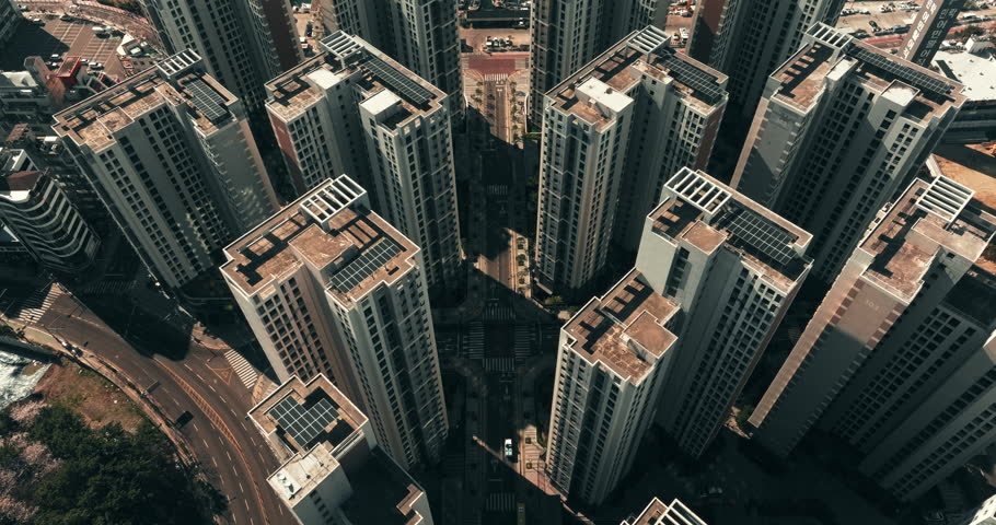 Aerial top down view of traffic and residential buildings in Busan, South Korea in the morning