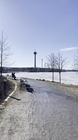 Beautiful Frozen lake view in spring walking beside lake