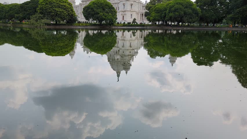 Pan Shot of Victoria Memorial’s Reflection in Pond in Kolkata, India