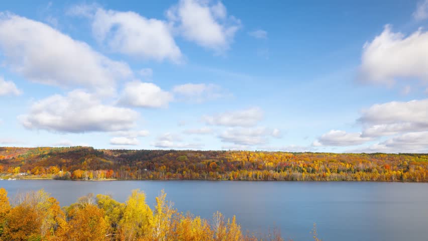 Time lapse of the clouds moving above the beautiful landscape near Houghton Michigan in the Autumn.