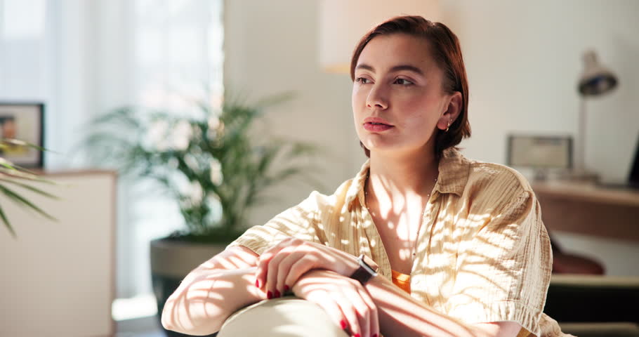 Thinking, smile and woman on sofa in home with self reflection, mental health and peace. Remember, relax and female person in living room with wellness decision, choice or memory in apartment.