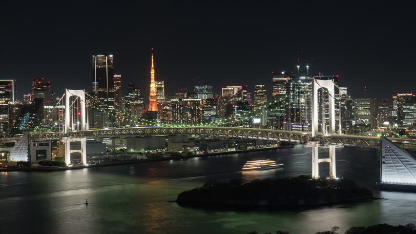 tokyo city bay timelapse from night to day high view of rainbow bridge with modern high rise office building in the background,waterfront ward,time lapse at sunrise dawn zoom out