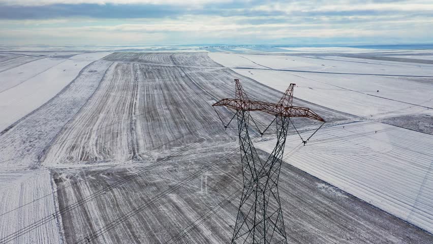 Image of a power transmission line taken in a snowy area.