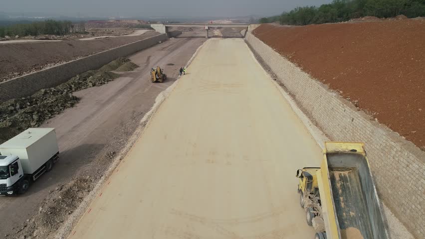 Aerial View of Earthwork and Dump Truck Operation in Infrastructure Corridor Construction
 - Powered by Shutterstock - Get 15% off with code: PIKWIZARD15