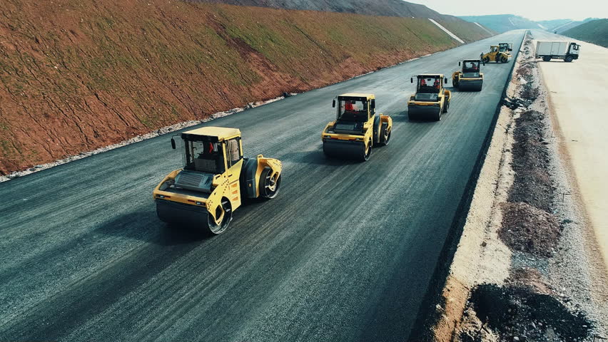 Multiple Road Rollers Compacting Fresh Asphalt | Synchronized Highway Construction Equipment
