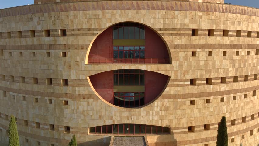  Torre Triana - Round Concrete Brutalist Building of Government Junta de Andalucia in Sevilla, Spain. Aerial Drone Shot.