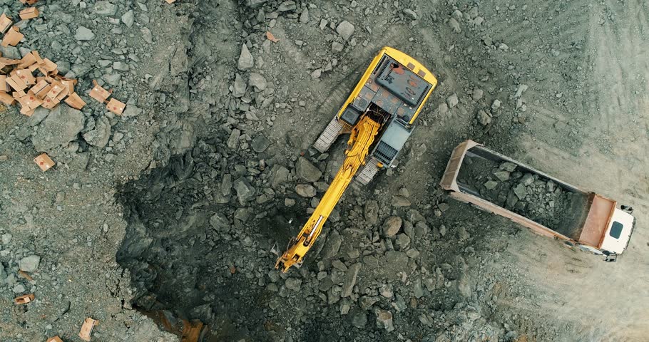 Excavator Loading Soil into Dump Truck at Construction Site | Earthmoving Operation