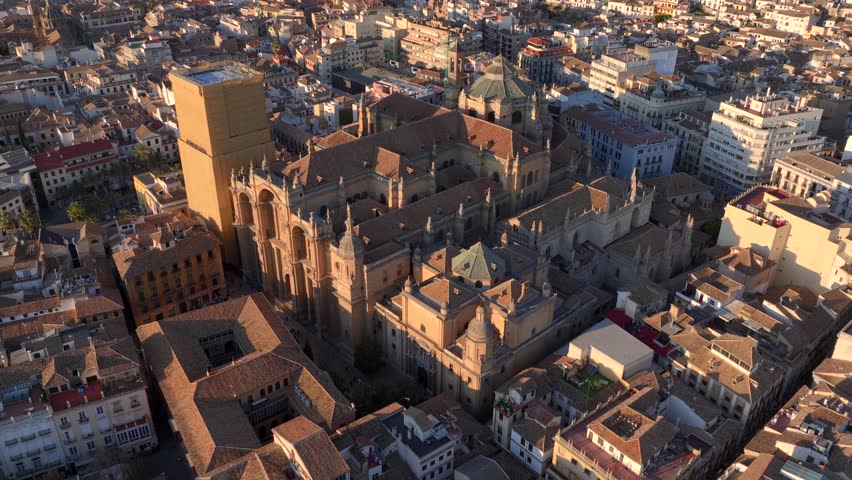 Granada Cathedral, Aerial drone footage of Granada old town in Andalusia, Spain. Aerial Shot on Sunset Light