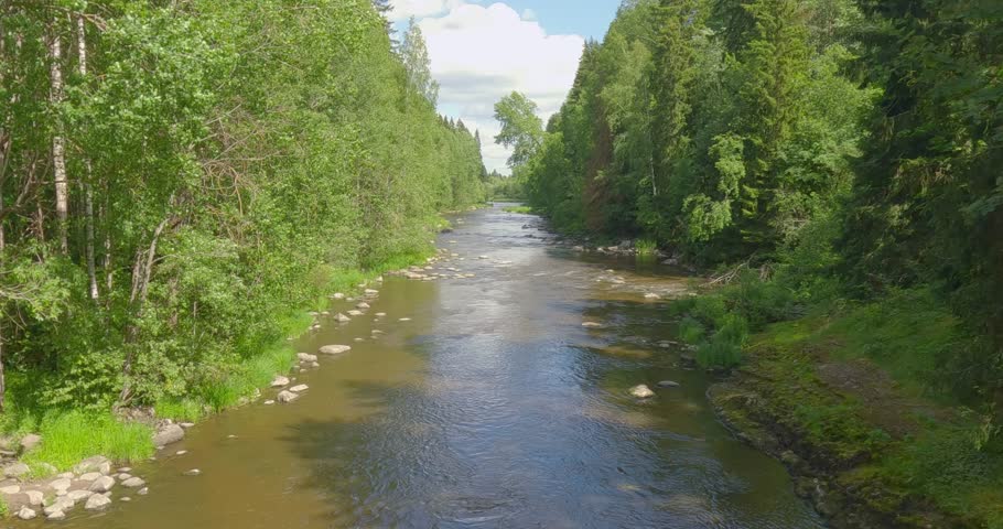 Landscape view at Pitkäkoski rapids in summer with clouds in the sky, Vantaa, Finland.