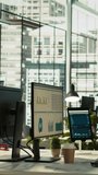 Vertical video Financial charts and KPI metrics on displays in office, panning shot. Vibrant and collaborative modern workspace with computer screens displaying data analytics, panning shot - Powered by Shutterstock - Get 15% off with code: PIKWIZARD15