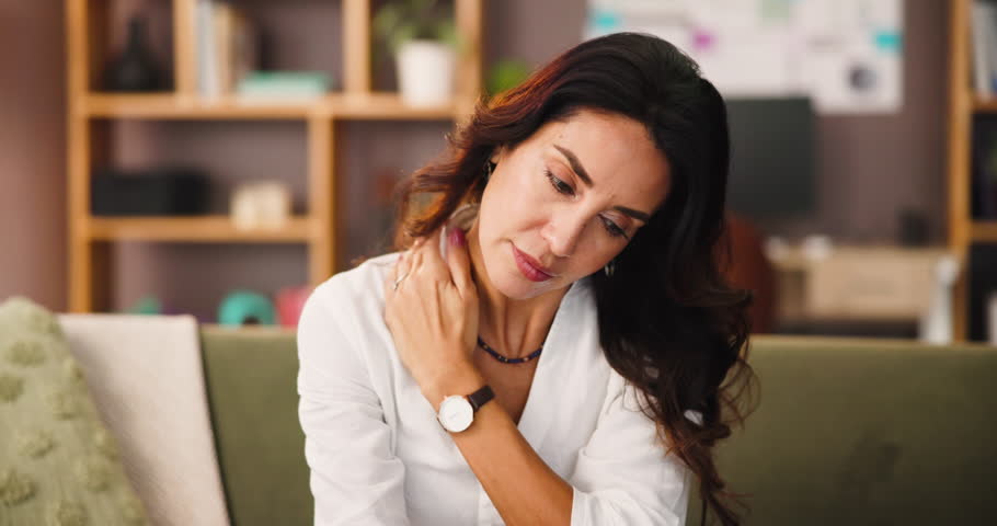 Woman, relax and neck pain in home with tension, bad posture and pinched nerve. Mature female person, stress or ache in living room with tense back, muscle stiffness and stretching for relief or care