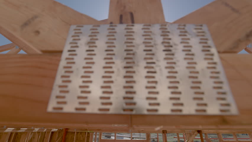 Dramatic Slow Motion Panning Movement of New Home Wood Framing Construction Site.