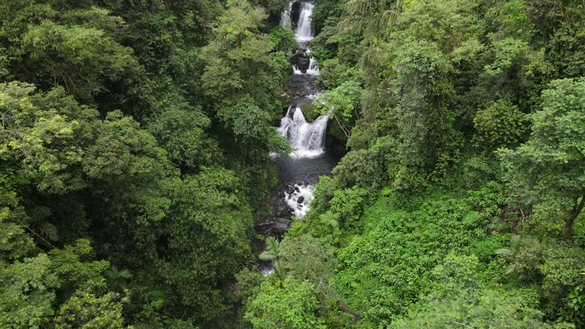 Aerial scenery of hidden and beautifu waterfall in the middle of forest