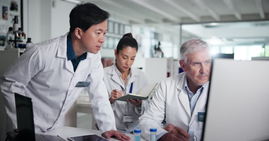People, scientist and discussion in group at lab, medical research and problem solving for solution. Men, woman and team with pc for clinical trial, listening and point for pharmaceutical study
