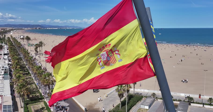 Spanish Flag At Valencia In Valence Community Spain. Spain Flag Scenery. Flag Wave Scene. Patriotic Spain Landscape. Spanish Flag At Valencia In Valence Community Spain.