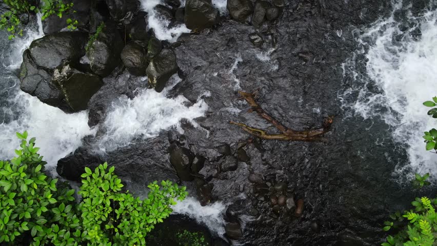 Aerial scenery of hidden and beautifu waterfall in the middle of forest