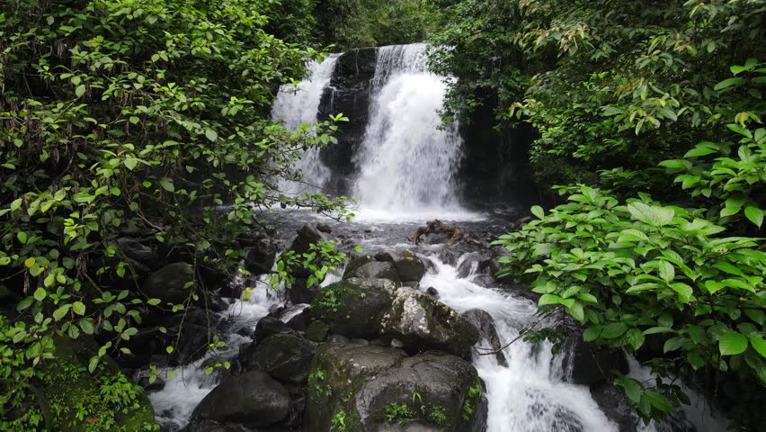 Aerial scenery of hidden and beautifu waterfall in the middle of forest