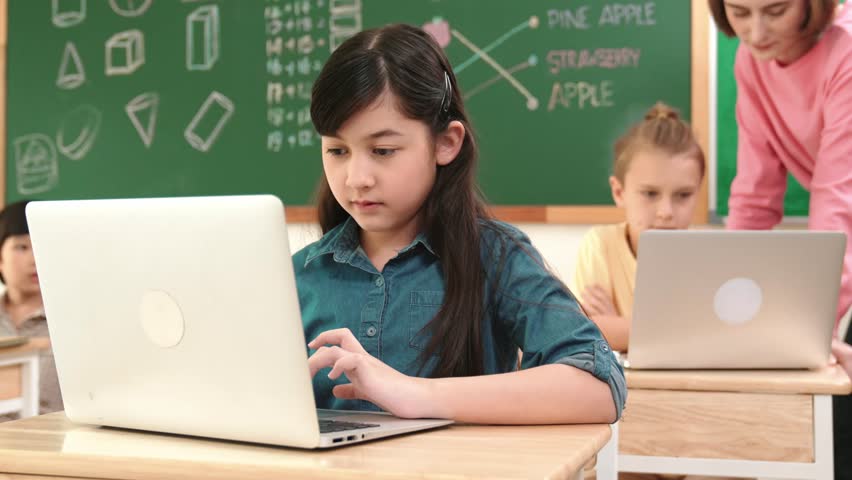 Smart asian girl looking at camera while coding engineering prompt. Multicultural student learning about generated AI while teacher teaching about system or checking classwork at STEM class. Pedagogy. - Powered by Shutterstock - Get 15% off with code: PIKWIZARD15