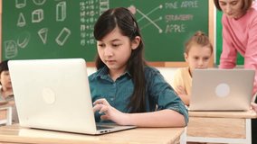 Smart asian girl looking at camera while coding engineering prompt. Multicultural student learning about generated AI while teacher teaching about system or checking classwork at STEM class. Pedagogy. - Powered by Shutterstock - Get 15% off with code: PIKWIZARD15