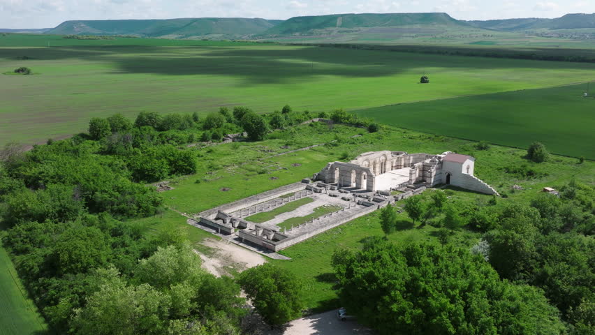 The Great Basilica of Pliska stands in open fields beneath distant hills in Bulgaria, marking the former religious heart of the First Bulgarian Empire.