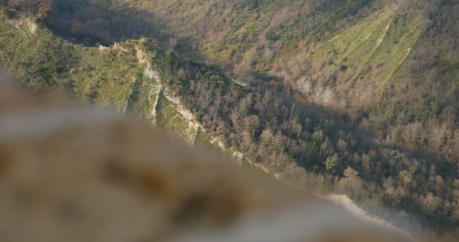 Scenery Of Rugged Mountains At Civita di Bagnoregio Hilltop Village In Central Italy. POV Shot