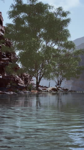 Reflection in Colorado River of Butte catching days last rays, in Grand Canyon.
