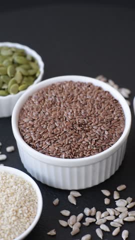 Flax seeds in a bowl, an ingredient for making vegan or vegetarian food. Tasty and healthy food