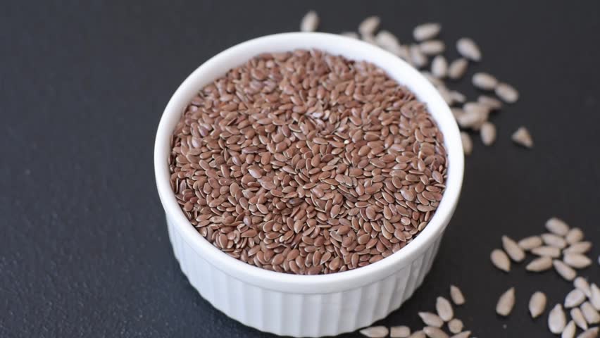 Flax seeds in a bowl, an ingredient for making vegan or vegetarian food. Tasty and healthy food