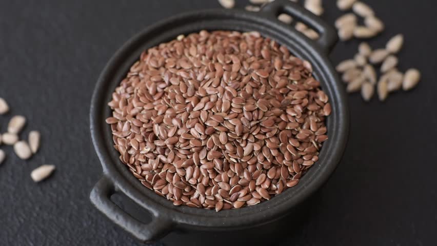 Flax seeds in a bowl, an ingredient for making vegan or vegetarian food. Tasty and healthy food