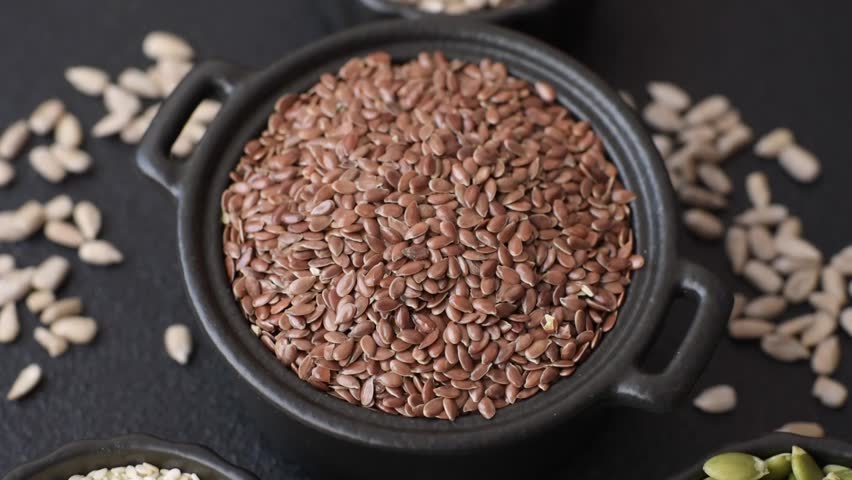 Flax seeds in a bowl, an ingredient for making vegan or vegetarian food. Tasty and healthy food