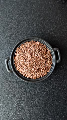 Flax seeds in a bowl, an ingredient for making vegan or vegetarian food. Tasty and healthy food