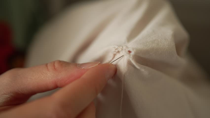 Experienced seamstress carefully gathering fabric with precise hand-stitching techniques, creating elegant folds and showcasing intricate textile craftsmanship in detailed close-up